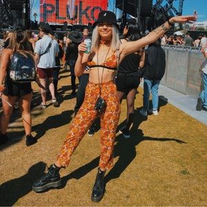 HERPONY the label, matching set orange floral bralette, pants & skirt.